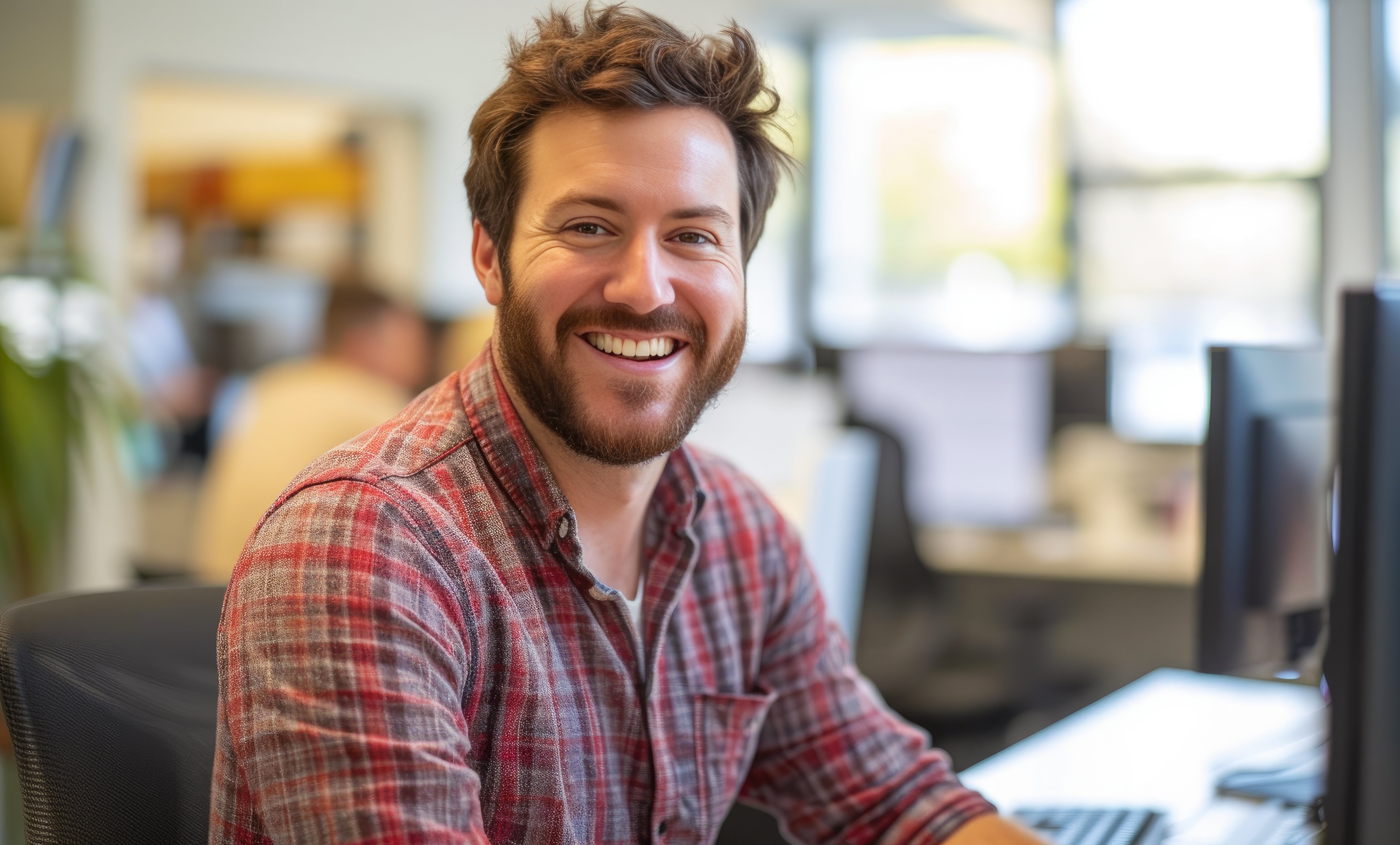 Cheerful Executive Reviewing Work on Computer