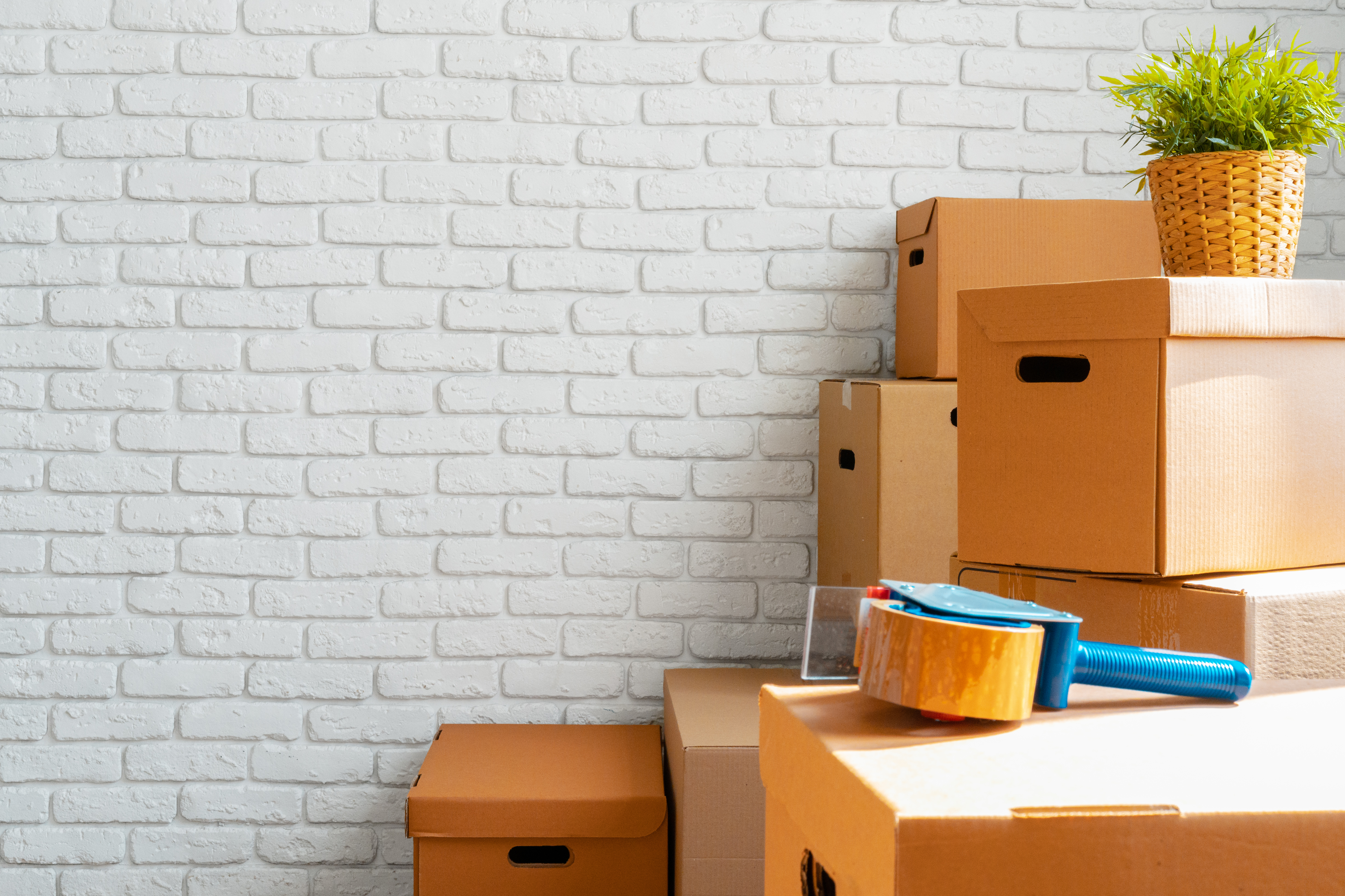 Close up of moving carton boxes in an empty room